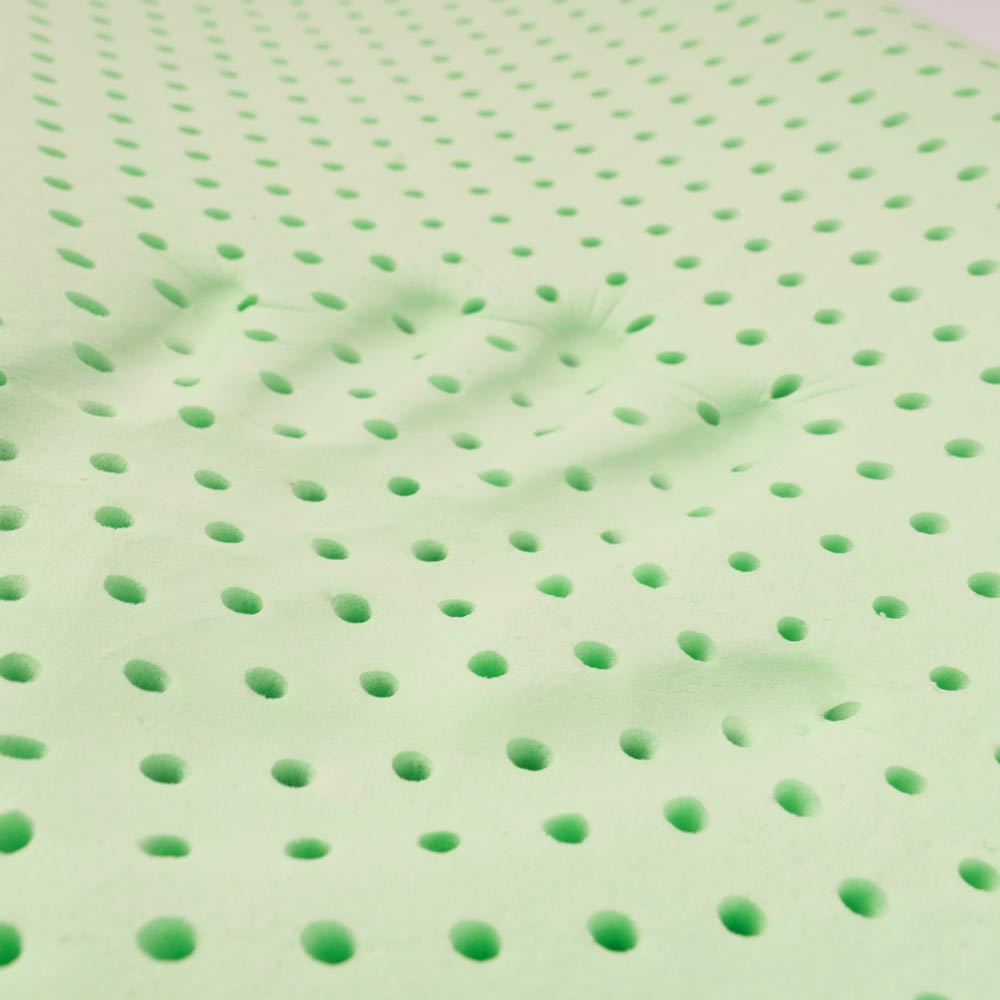 Superficie verde con fori disposti uniformemente.