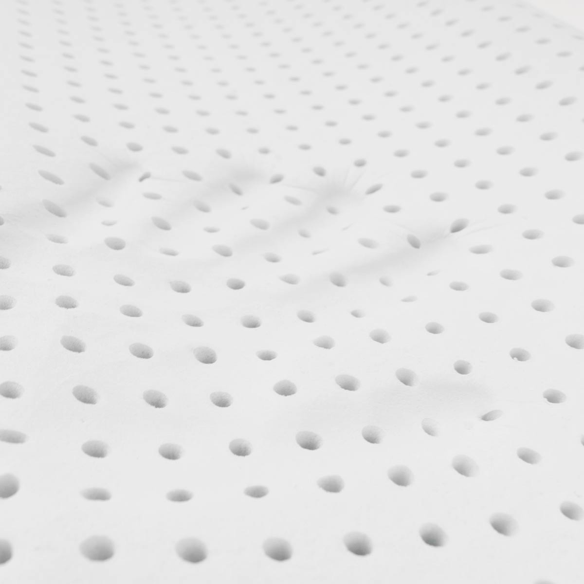 Superficie bianca con piccoli fori disposti regolarmente.