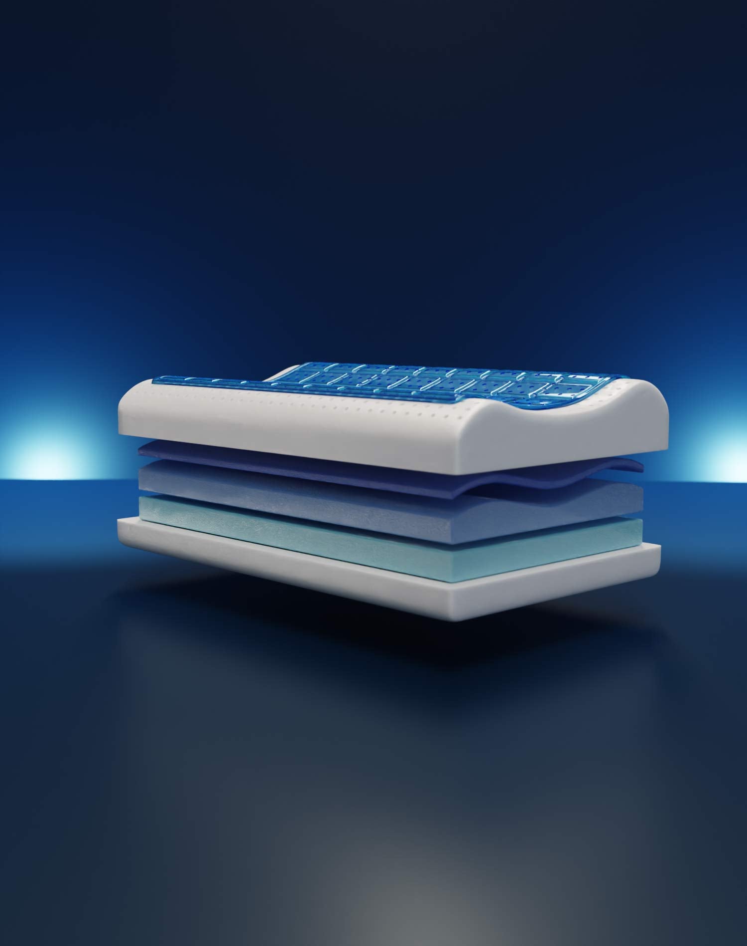 Materasso a strati blu e bianchi su sfondo scuro.