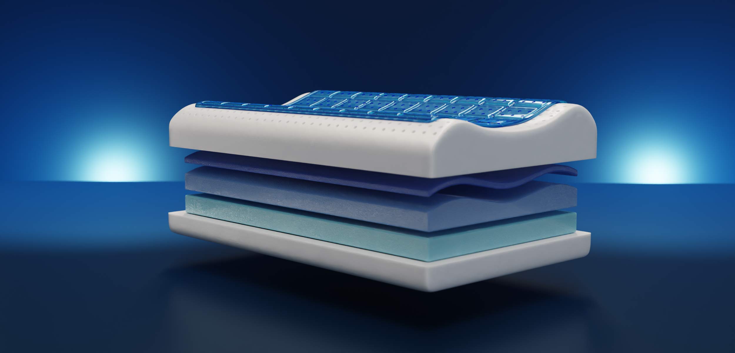 Sezione di un materasso multistrato con strato superiore blu.